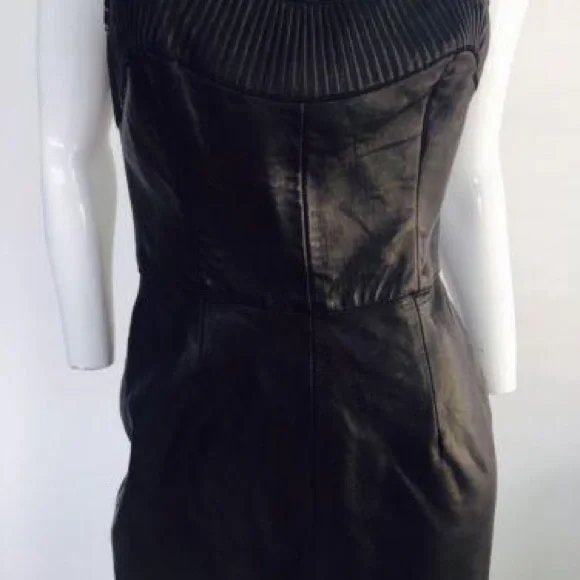 Black leather  strapless dress. 

Features a sweetheart plunge cleavage. - Picture 2 of 11